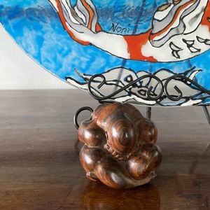 Wood carved meditating man figurine